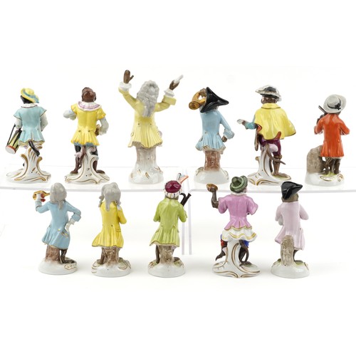 26 - A 20th century eleven piece German porcelain monkey band, after Meissen, comprising Älteste Volksted... 