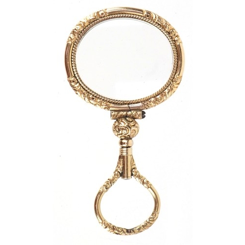 301 - A 19th century gold plated quizzing glass, 7.1cm high.