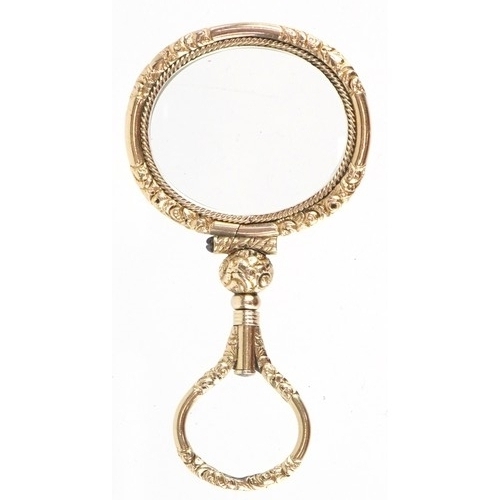 301 - A 19th century gold plated quizzing glass, 7.1cm high.