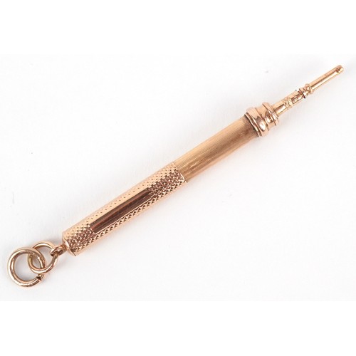 52 - A Tiffany & Co. 18ct gold cased engine turned propelling pencil 7cm in length extended, 7.5g.