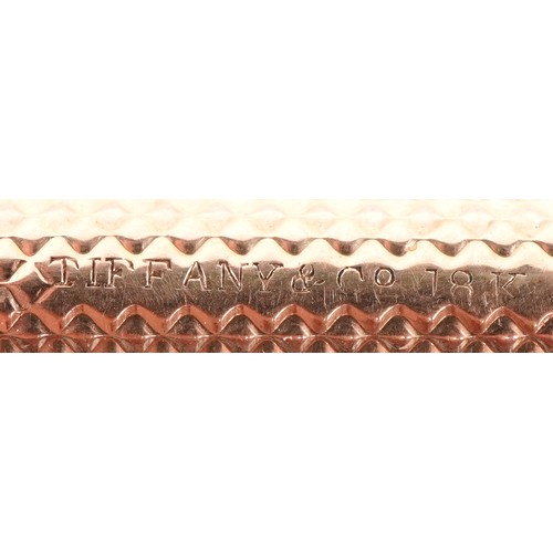 52 - A Tiffany & Co. 18ct gold cased engine turned propelling pencil 7cm in length extended, 7.5g.