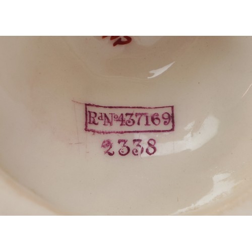320 - A Victorian Royal Worcester blush ivory twin handled vase decorated with flowers, numbered 2338, 23c... 