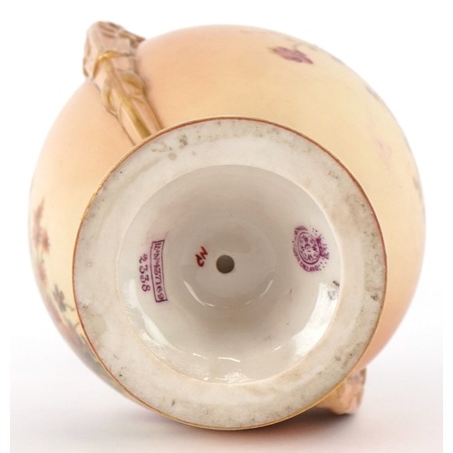 320 - A Victorian Royal Worcester blush ivory twin handled vase decorated with flowers, numbered 2338, 23c... 