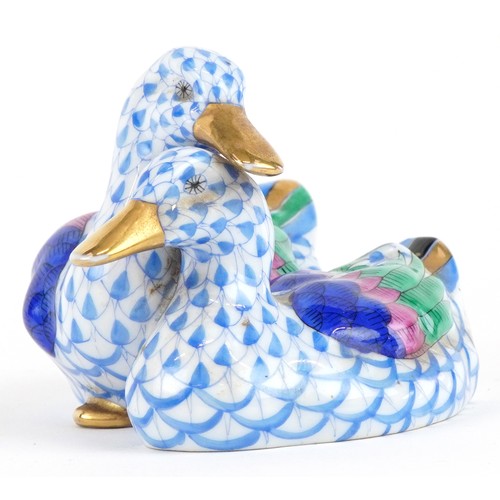 611 - Herend, a Hungarian porcelain figure group of two ducks hand painted in the Fishnet pattern, 11.5cm ... 
