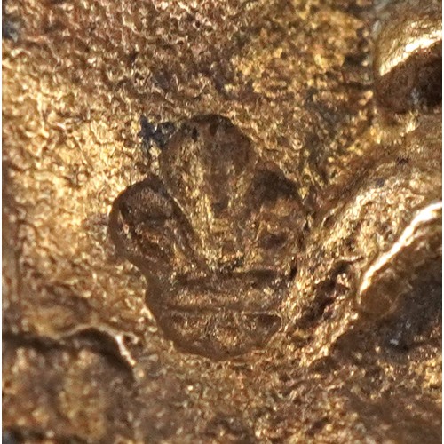 3656 - A set of three silver gilt souvenir spoons with masked bowls and figural finials including a dragon,... 