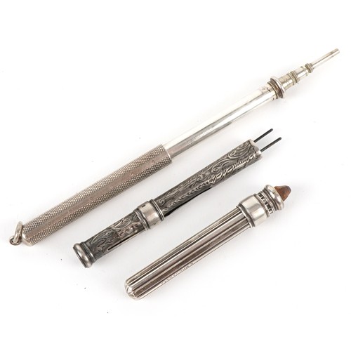 69 - Three silver propelling pencil cases, the largest 7.7cm in length, total 40.2g.