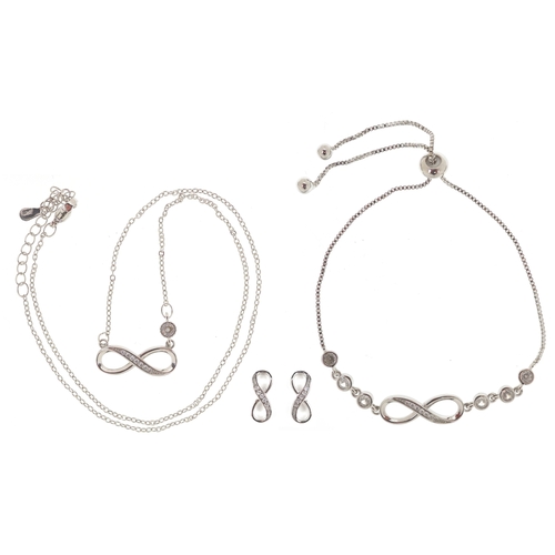 3435 - A silver infinity jewellery suite set with clear stones comprising necklace, bracelet and stud earri... 