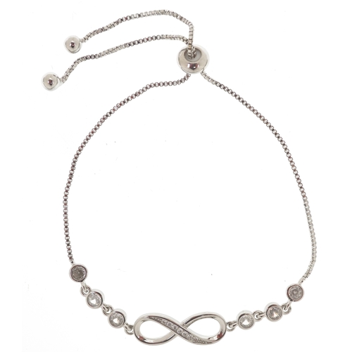 3435 - A silver infinity jewellery suite set with clear stones comprising necklace, bracelet and stud earri... 