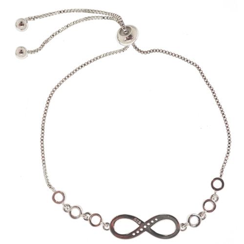 3435 - A silver infinity jewellery suite set with clear stones comprising necklace, bracelet and stud earri... 
