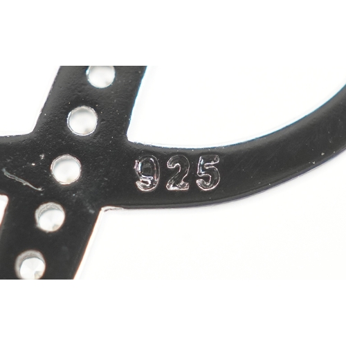 3435 - A silver infinity jewellery suite set with clear stones comprising necklace, bracelet and stud earri... 