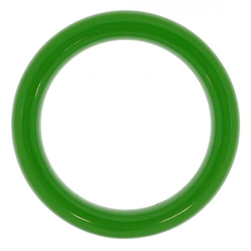 3354 - A Chinese green stone bangle, 7.5cm in diameter, 56.2g.