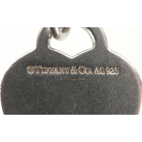 3090 - Tiffany & Co., a Return to Tiffany silver bracelet with blue enamel splash finish and Return to Tiff... 