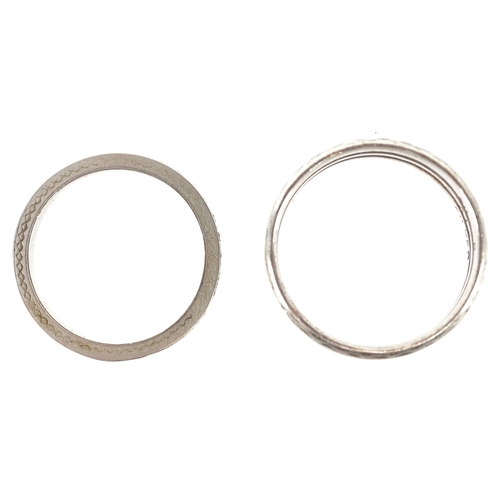 3268 - Silver jewellery comprising a Past Times Celtic design bangle, two eternity rings and a Middle Easte... 