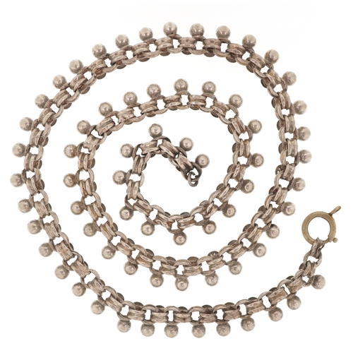 3268 - Silver jewellery comprising a Past Times Celtic design bangle, two eternity rings and a Middle Easte... 