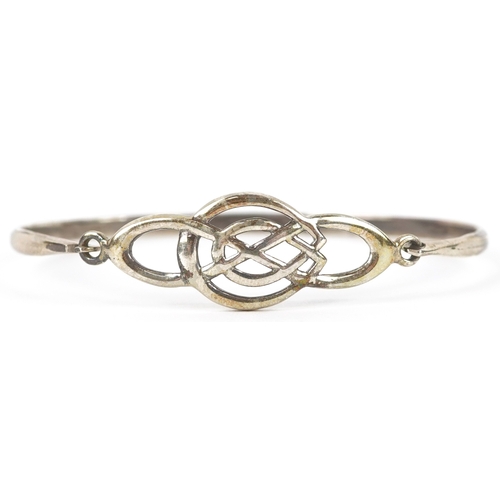 3268 - Silver jewellery comprising a Past Times Celtic design bangle, two eternity rings and a Middle Easte... 