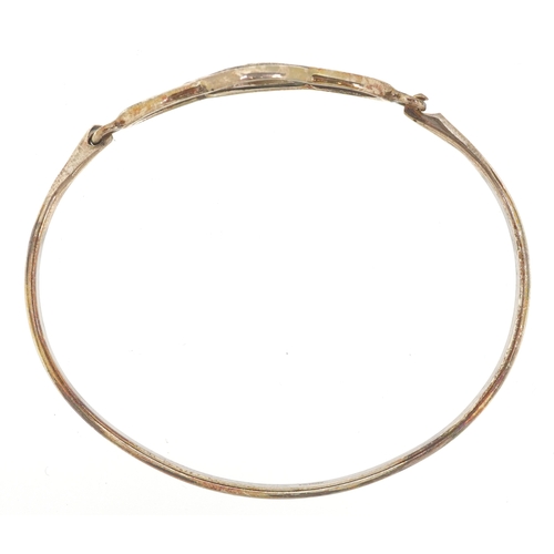 3268 - Silver jewellery comprising a Past Times Celtic design bangle, two eternity rings and a Middle Easte... 