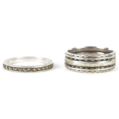 3268 - Silver jewellery comprising a Past Times Celtic design bangle, two eternity rings and a Middle Easte... 