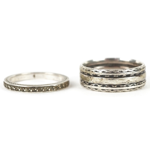 3268 - Silver jewellery comprising a Past Times Celtic design bangle, two eternity rings and a Middle Easte... 