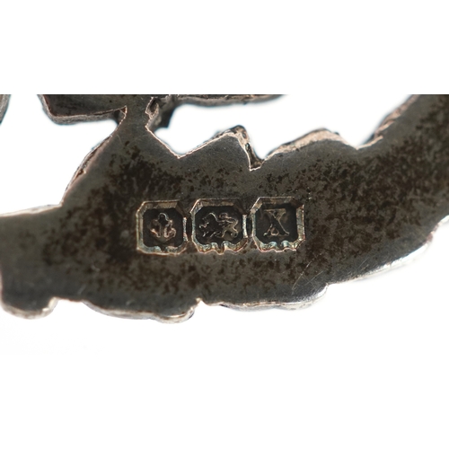 3443 - A silver watch chain with T bar, sports jewel and dog clip clasp, 34cm in length, 53.8g.