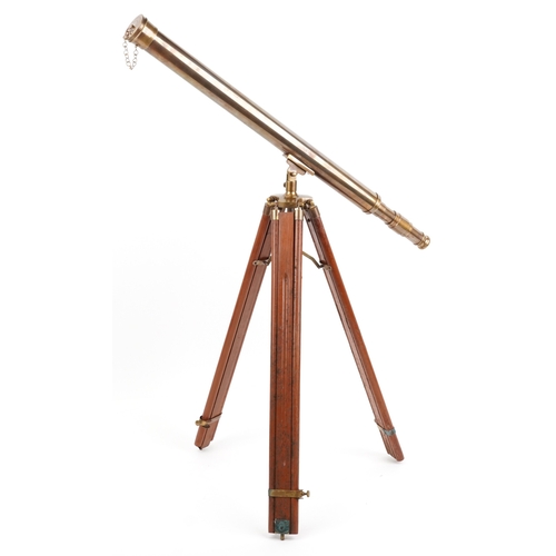 1872 - A floor standing brass telescope with adjustable tripod base, the telescope 100cm in length.