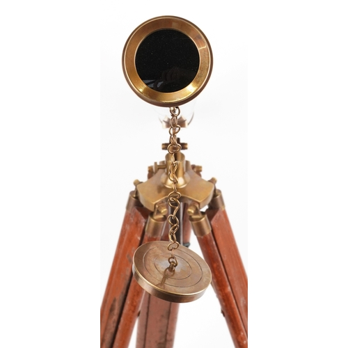 1872 - A floor standing brass telescope with adjustable tripod base, the telescope 100cm in length.