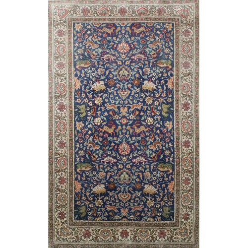 2225A - A Persian silk rug, mid 20th century, the blue field with a tree of life floral design with various ... 