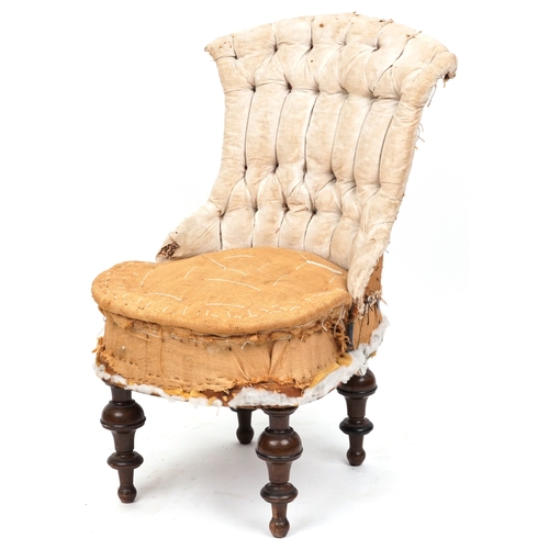 2129 - An early Victorian un-upholstered buttoned back salon chair raised on turned legs, 87cm high x 48cm ... 