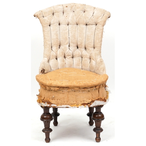 2129 - An early Victorian un-upholstered buttoned back salon chair raised on turned legs, 87cm high x 48cm ... 