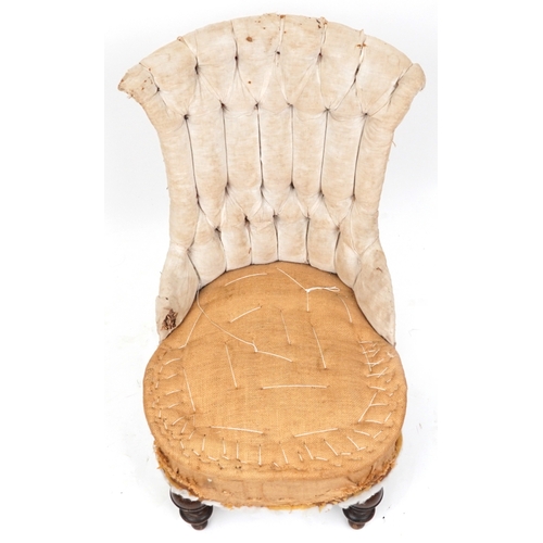 2129 - An early Victorian un-upholstered buttoned back salon chair raised on turned legs, 87cm high x 48cm ... 