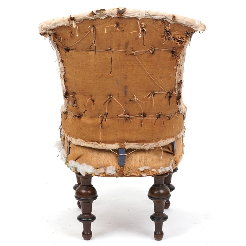 2129 - An early Victorian un-upholstered buttoned back salon chair raised on turned legs, 87cm high x 48cm ... 