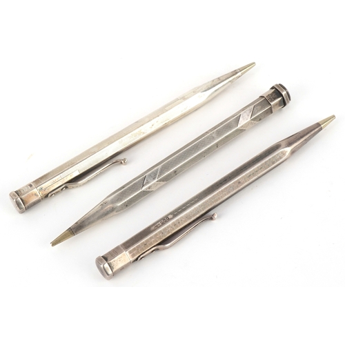 73 - Four engine turned silver propelling pencils including Yard-O-Led, the largest 12.5cm in length.