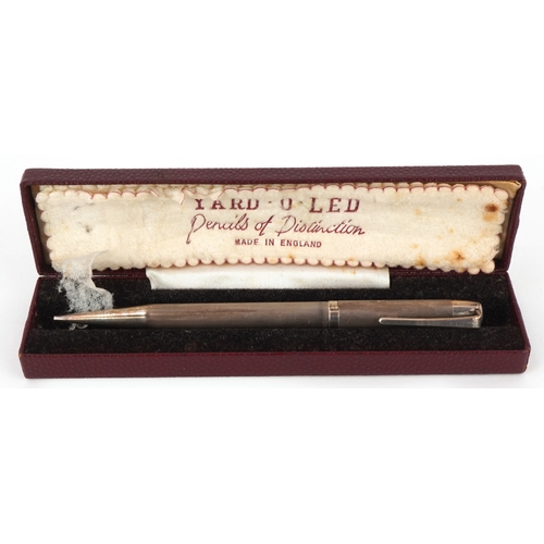 73 - Four engine turned silver propelling pencils including Yard-O-Led, the largest 12.5cm in length.