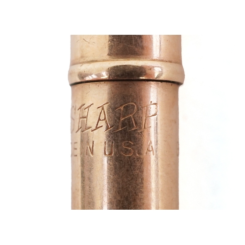 85 - Six gold plated and yellow metal propelling pencils, some with engine turned decoration including Cr... 