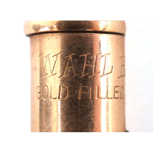 85 - Six gold plated and yellow metal propelling pencils, some with engine turned decoration including Cr... 