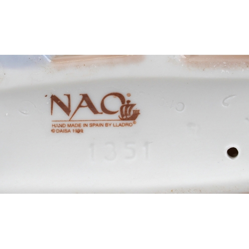 656 - Six Nao porcelain figures of young children including a boy at a desk, young girl with a teddy bear ... 