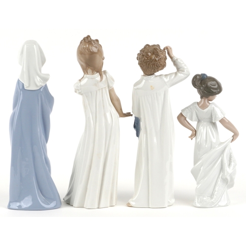 655 - Four Nao porcelain figures including a boy and girl in nightclothes, the largest 27cm high.