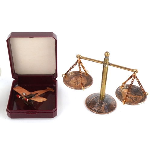 2821 - Sundry items including a German military interest porcelain miniature po, enamelled military interes... 