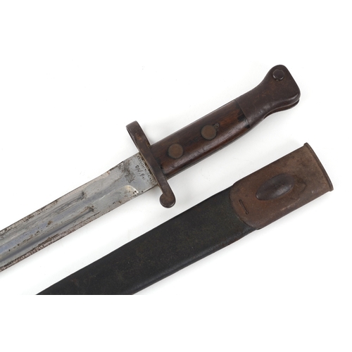 2852 - A British military issue War Department bayonet and scabbard, impressed marks to the blade, 44cm in ... 