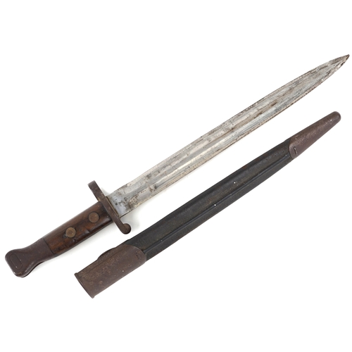2852 - A British military issue War Department bayonet and scabbard, impressed marks to the blade, 44cm in ... 