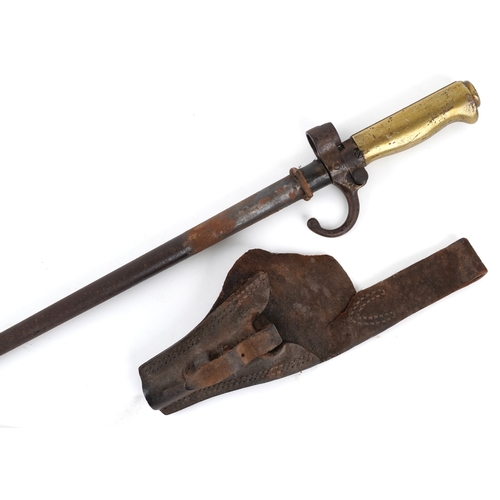 2850 - A French military interest bayonet and scabbard with cross blade, 65cm in length.