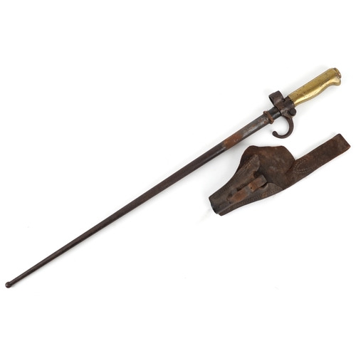 2850 - A French military interest bayonet and scabbard with cross blade, 65cm in length.