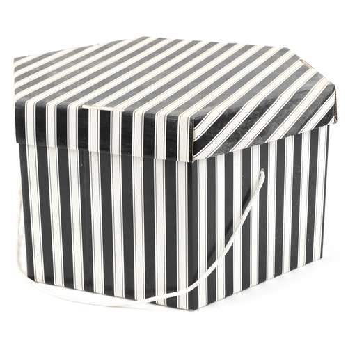 1030A - Three vintage ladies hats in a hatbox.