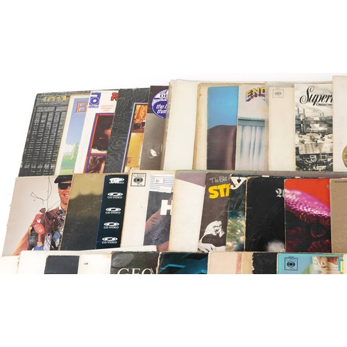 A collection of vinyl LP records including The Doors LA Woman, David ...
