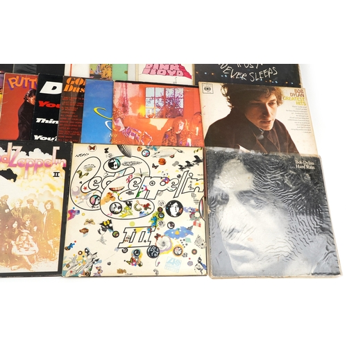 A collection of vinyl LP records including The Doors LA Woman, David ...