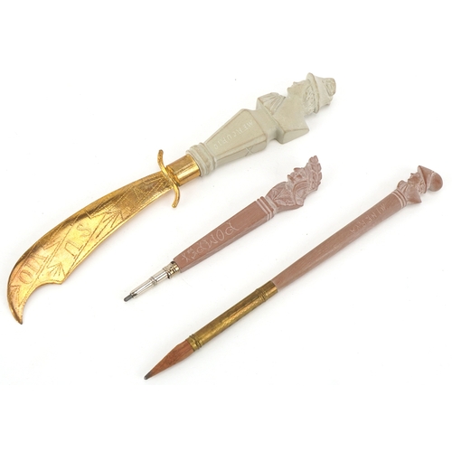80 - A set of three lava cameo writing instruments comprising two pencils and letter opener carved with c... 