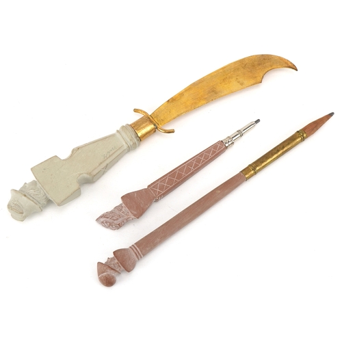 80 - A set of three lava cameo writing instruments comprising two pencils and letter opener carved with c... 