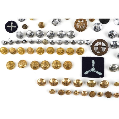 2808 - A large collection of British military interest cap badges and uniform buttons, various regiments.