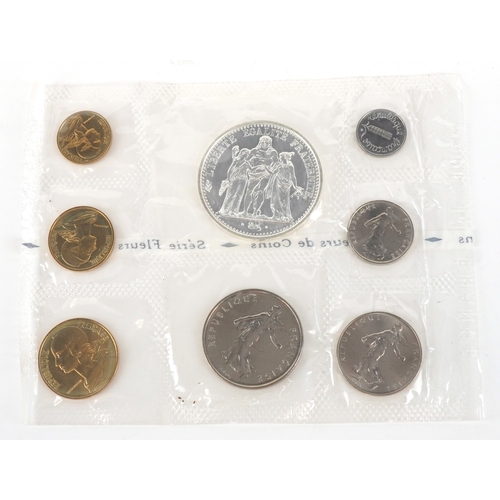 1151 - A French 1973 eight coin set including a 900 grade silver ten francs, housed in a plastic sleeve wit... 