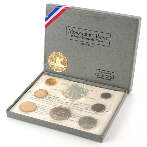 1151 - A French 1973 eight coin set including a 900 grade silver ten francs, housed in a plastic sleeve wit... 