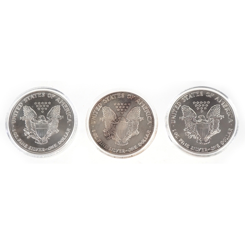 1114 - Three USA one ounce fine silver walking Liberty dollars including a matte proof example, dates 1987,... 